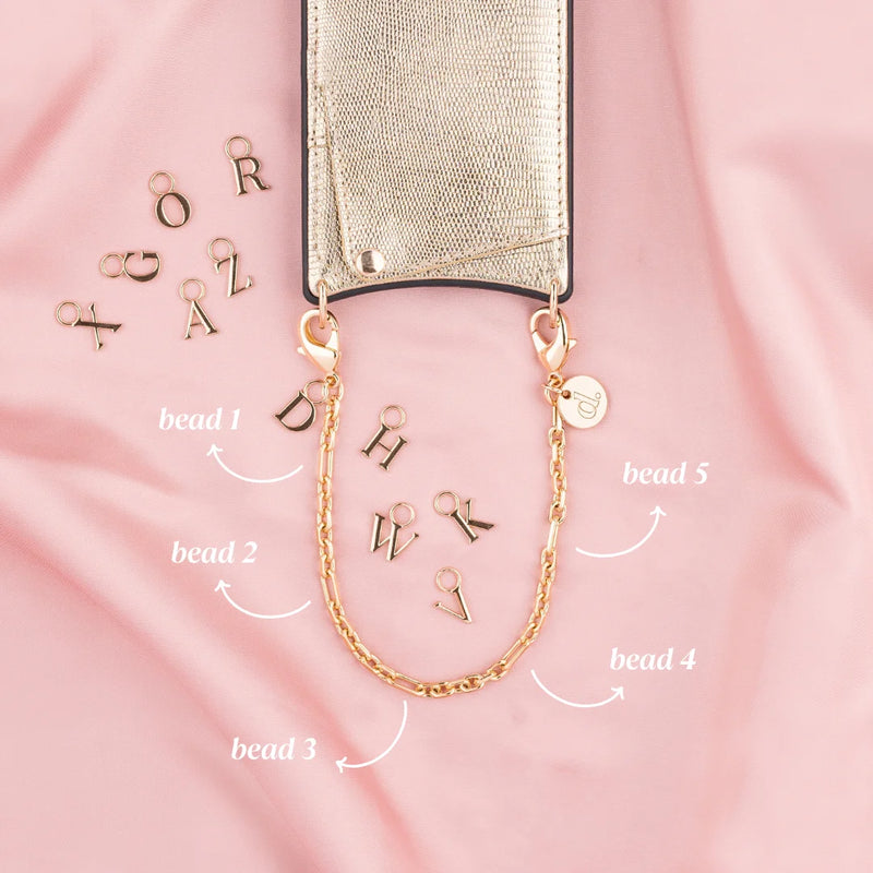 Phone Charm | Gold | Dutch Bandolier showcasing customizable beads and a chic gold chain.