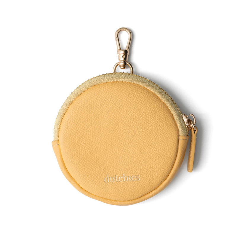 Mini Phone Bag Emma | Yellow round pouch in genuine leather with clip for convenience.