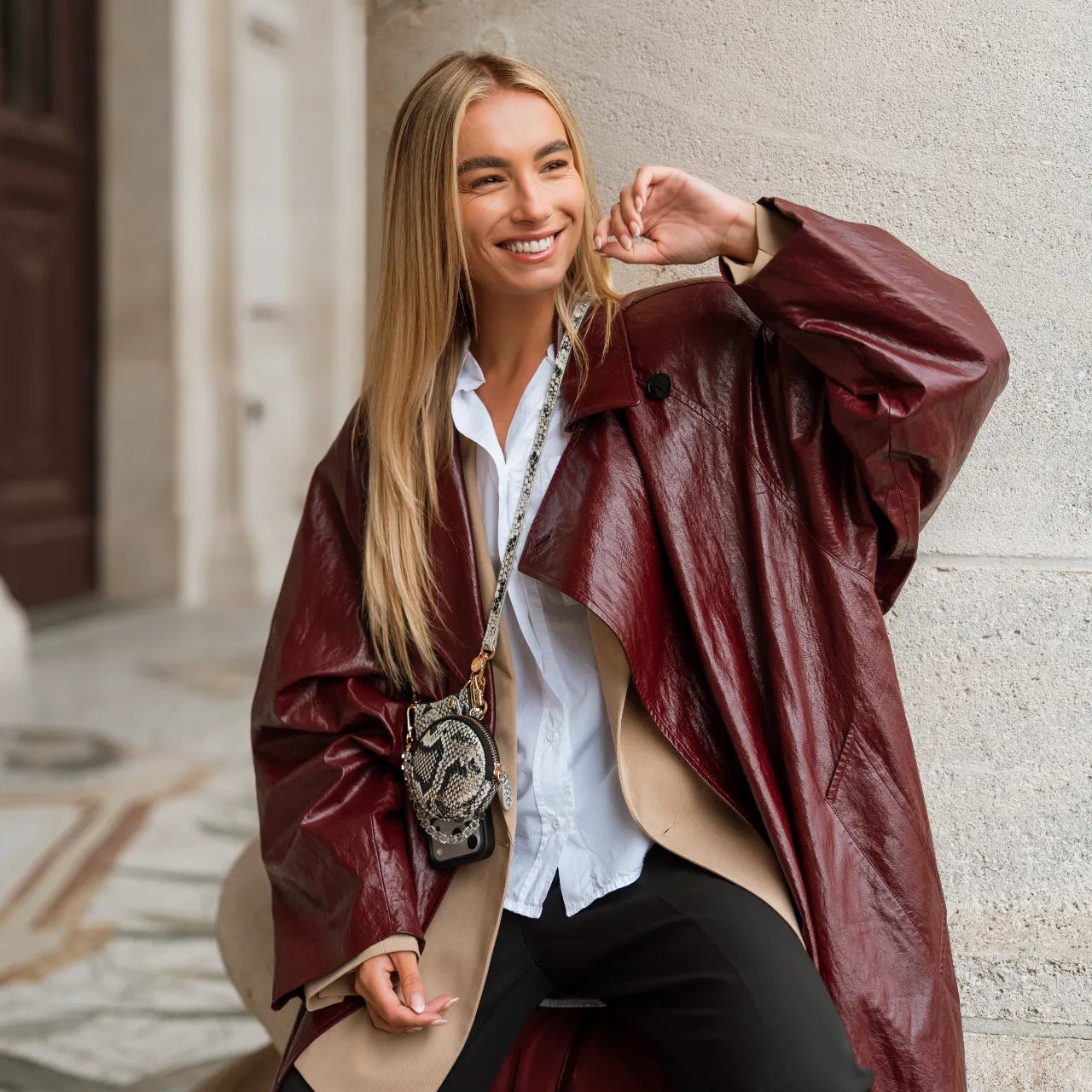 Phone Strap | Slimline | Snake stylishly worn by a woman in a trendy outfit and leather jacket.
