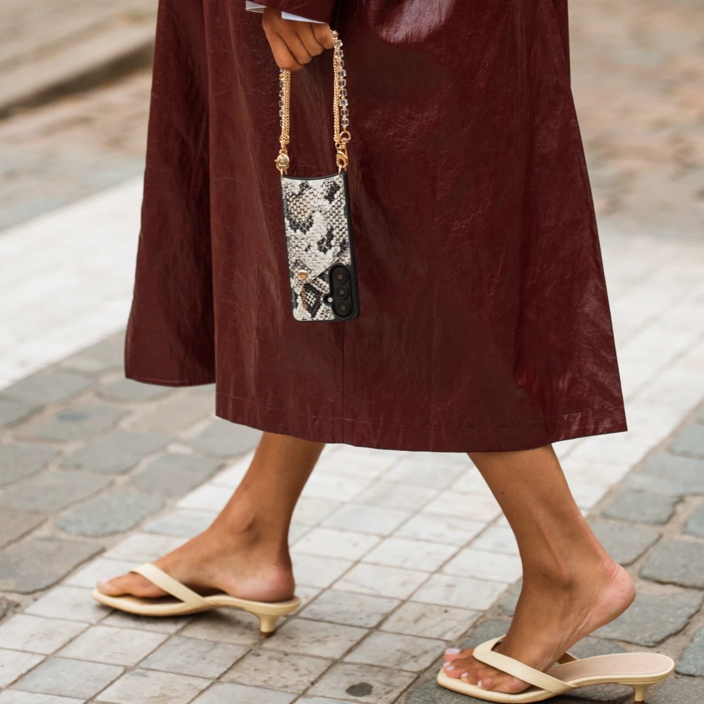 Samsung Case | Snake showcased with an elegant outfit on a city street, highlighting the stylish snake print design.
