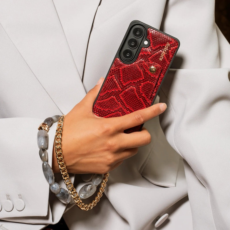 Phone Charm | Beaded | Ada with a stylish red phone case and beaded bracelet in a fashionable setting.