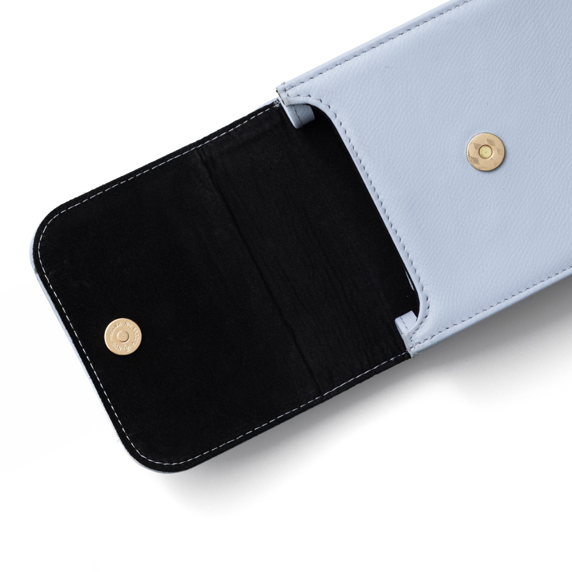 Inside view of Phone Bag Juliet | Blue showing soft black lining and button closures.