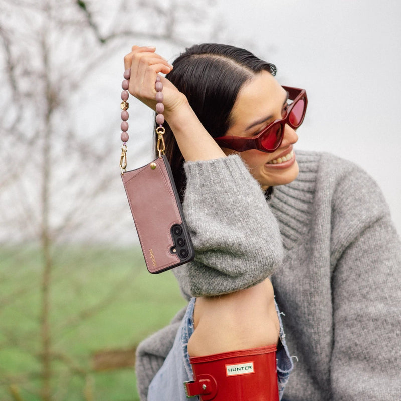 Phone Charm | Beaded | Eileen showcased on a model with a stylish gray sweater and red sunglasses, exuding elegance.