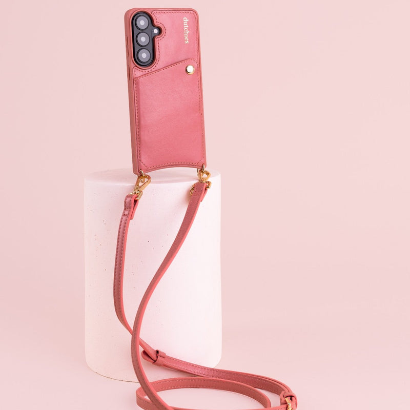 Classic set | Samsung | Pink phone case with strap on a pink pedestal, stylish, modern and practical.