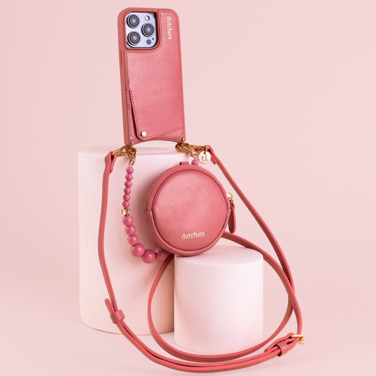 Mini Phone Bag Emma | Pink displayed with pink smartphone and trendy accessories on pastel background.