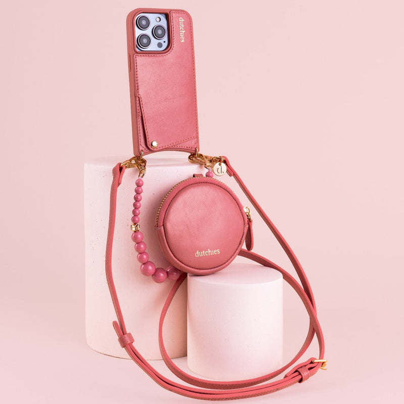 Mini Phone Bag Emma | Pink displayed with pink smartphone and trendy accessories on pastel background.