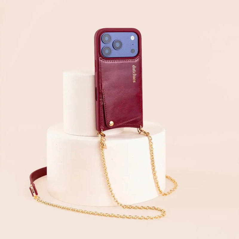 Spanish Chain Set | iPhone | Raspberry Red displayed on a pedestal with a stylish chain.