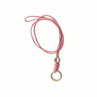 Sunglass Strap | Pink, handmade leather cord with key ring for securing sunglasses.