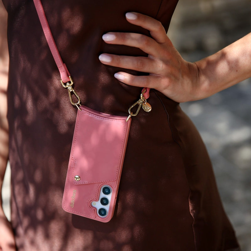 Phone strap | Slimline | Pink attached to a stylish outfit for hands-free convenience and modern elegance.