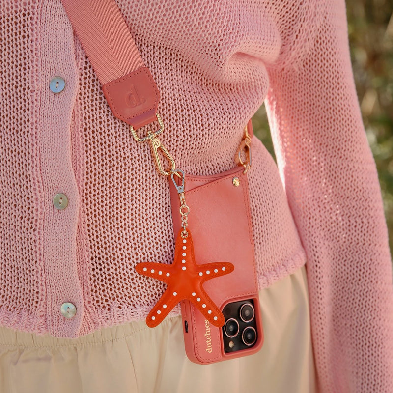 Phone Strap | Basic | Pink worn casually with a phone case and a fun starfish charm, perfect for hands-free style.