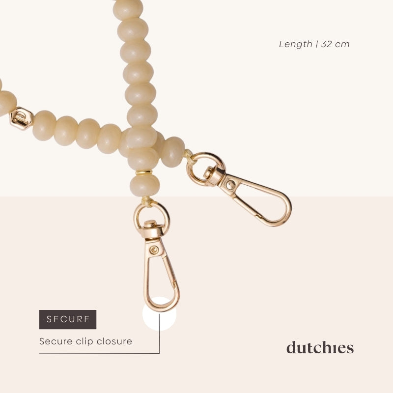 Phone Charm | Beaded | Marisa featuring a secure clip closure and stylish beige beads, elegant accessory for phones.