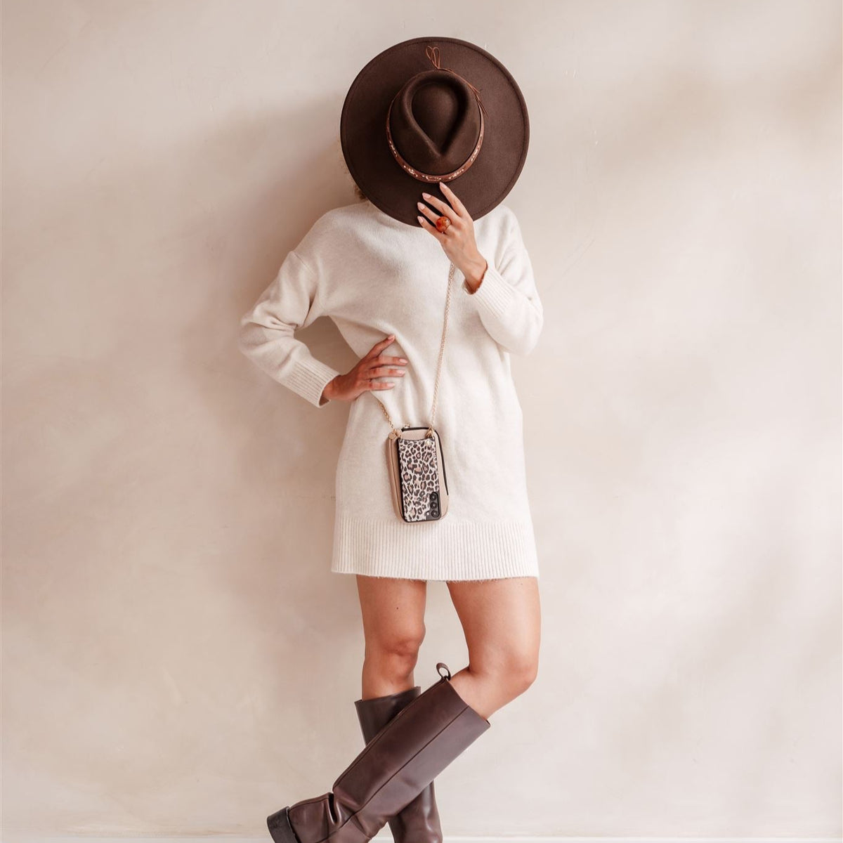 Model wearing a cozy cream dress with brown boots and a stylish Phone Bag ROSE | Beige.