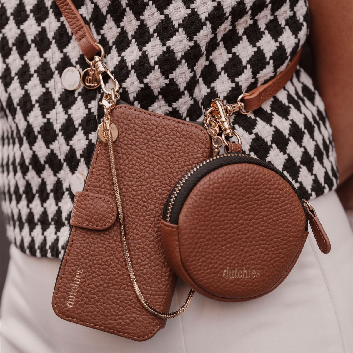 Samsung Wallet Case | Brown against a stylish outfit, showcasing premium leather with gold accents.