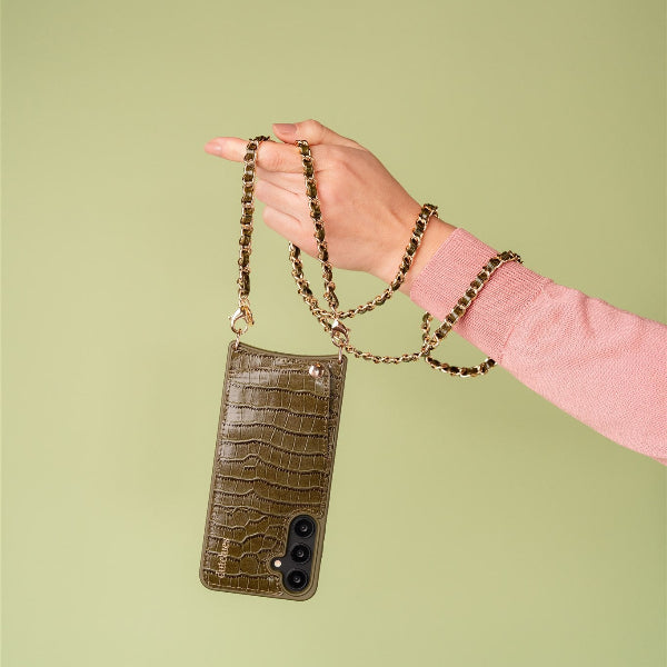Phone Chain | Italian | Olive Green hanging from a hand, showcasing its chic design and stylish details.
