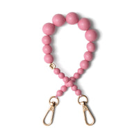 Ciondolo per telefono | Con perline | Alexandra - cordino per telefono con perline rosa e ganci dorati per accessori eleganti.