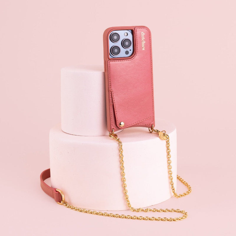 Phone Chain | Spanish | Pink attached to a stylish pedestal displaying its trendy design.