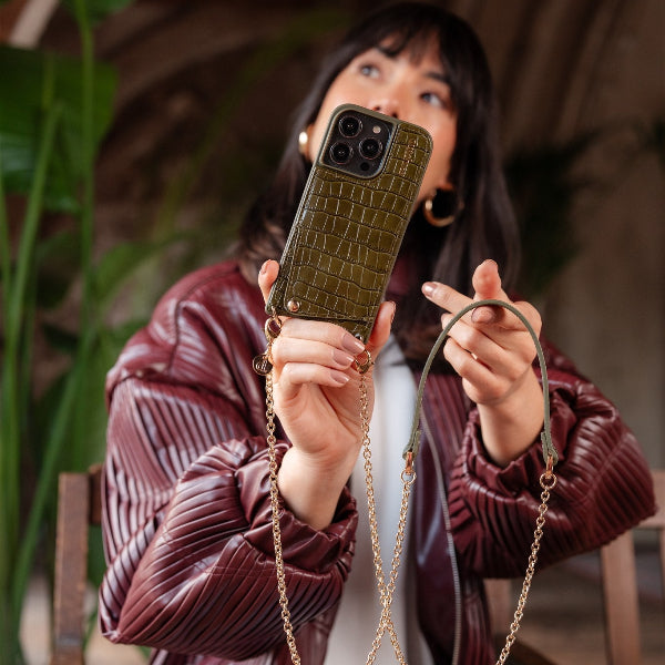Spanish Chain Set | iPhone | Olive Green shown with a stylish model holding the olive green case and chain.
