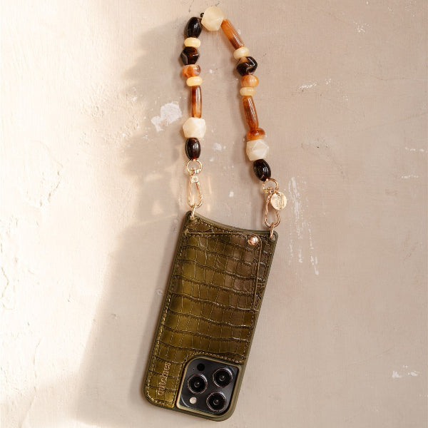 Phone Charm | Beaded | Vanessa featuring a stylish multicolored beaded strap and a chic green phone case.