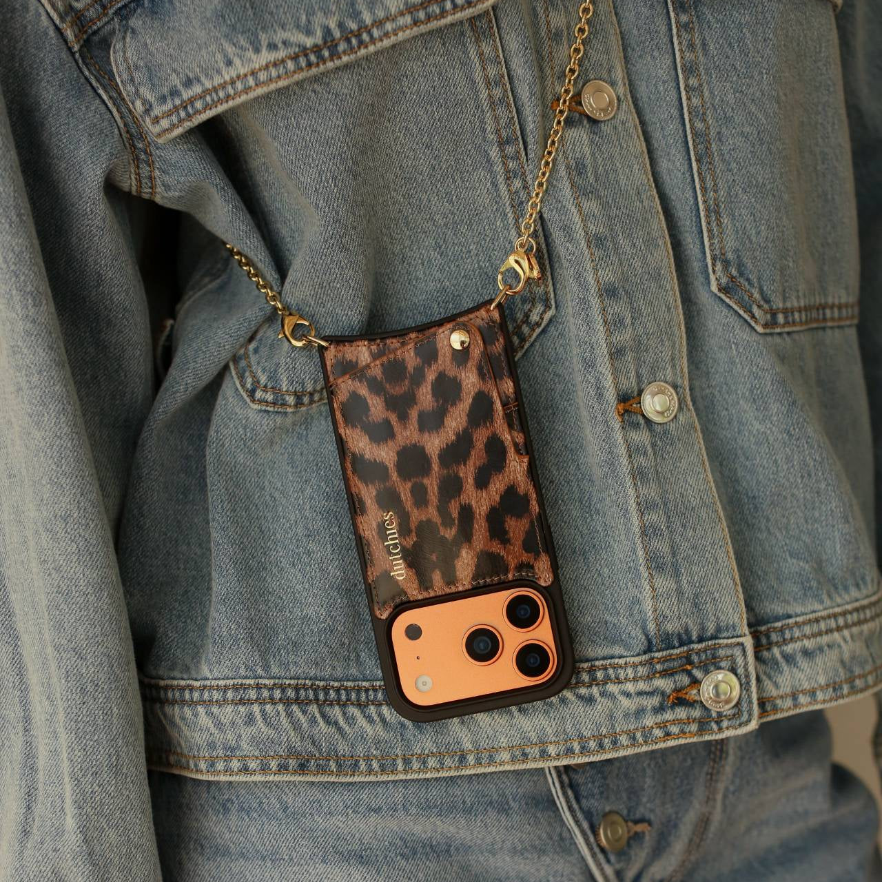 Spanish Chain Set | iPhone | Leopard - Stylish leopard print phone case with chain worn on denim jacket.