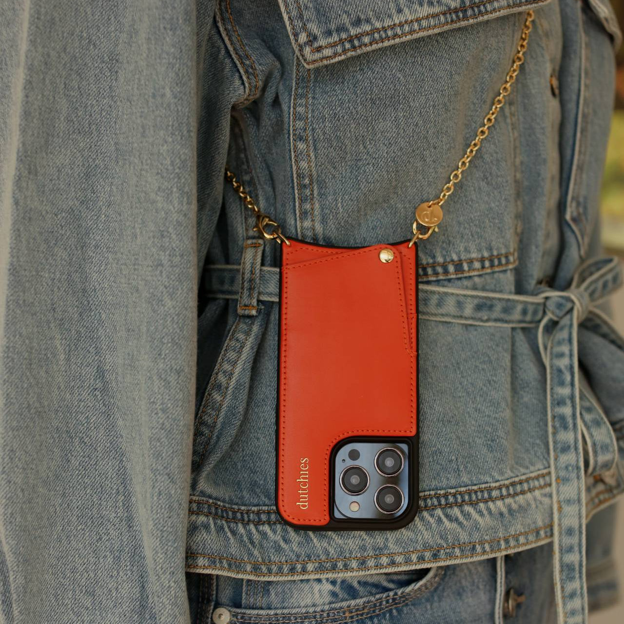 Spanish Chain Set | iPhone | Orange - stylish orange iPhone case on a denim jacket with a gold chain.