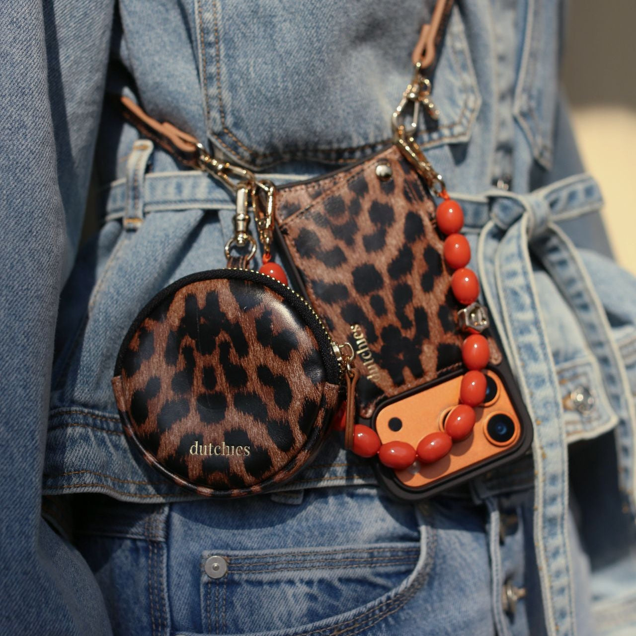 Mini Phone Bag Emma | Leopard displayed stylishly on a denim jacket with accessories.